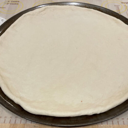 Pizza crust on pizza pan