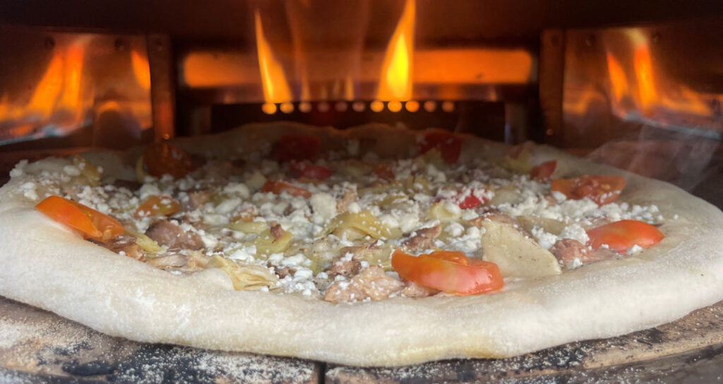 Sardine pizza in the oven