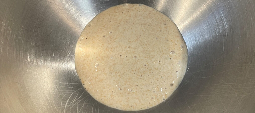 Add the sourdough starter to the mixing bowl.