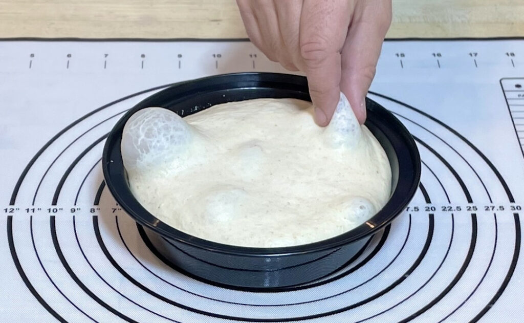 Pinch the air bubbles in the dough