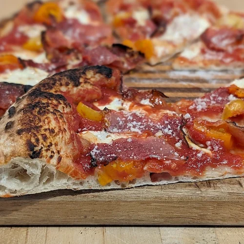 Speck & Tomato Pizza in cross section.